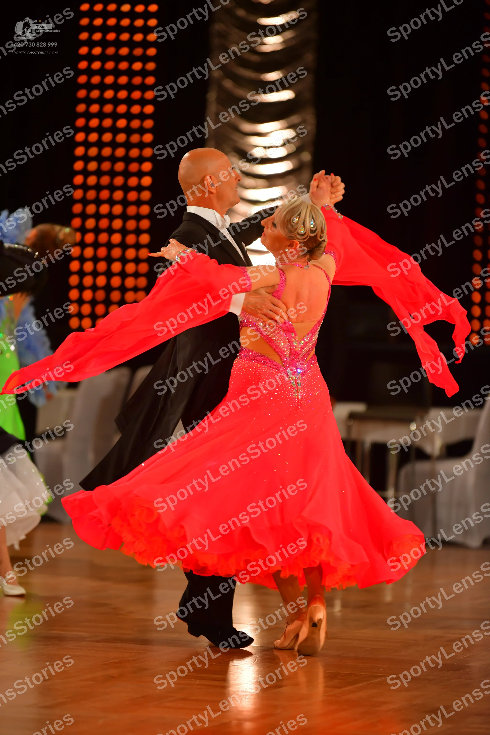 Dancesport competitor: Male dancer: black suit with white shirt and black trousers