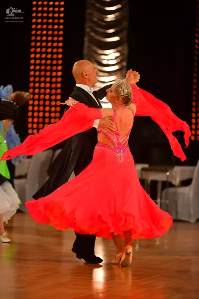 Dancesport competitor: Male dancer: black suit with white shirt and black trousers