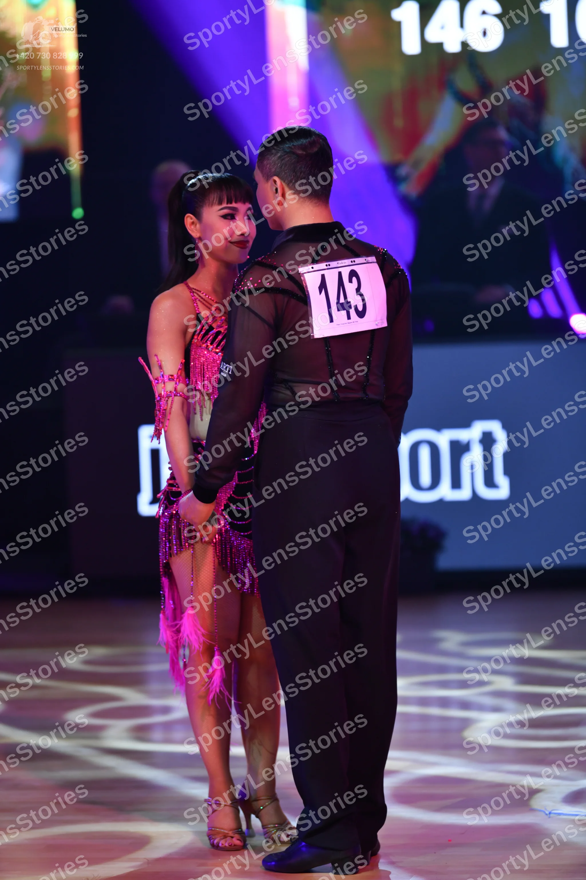 Dancesport competitor: Male dancer: black long-sleeved shirt with sheer mesh fabric on the upper chest