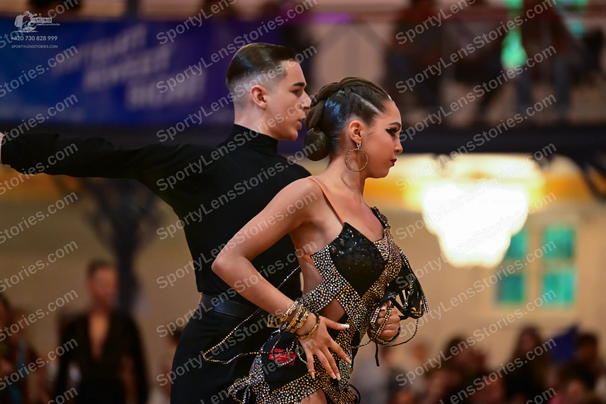 Dancesport competitor: Male dancer: black long-sleeved high-neck top and black trousers