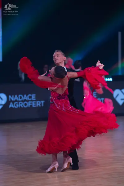 Dancesport competitor: Male dancer: black suit