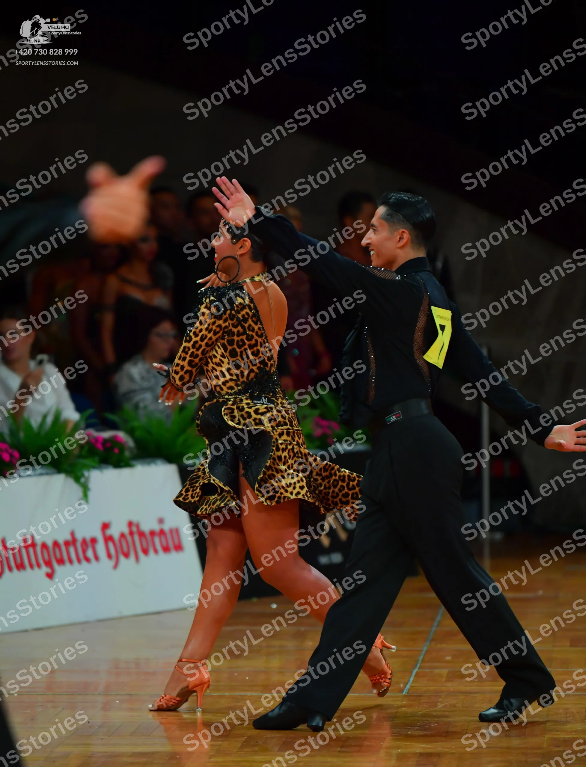 Dancesport competitor: Male dancer: black long-sleeved shirt and black trousers with black dance shoes