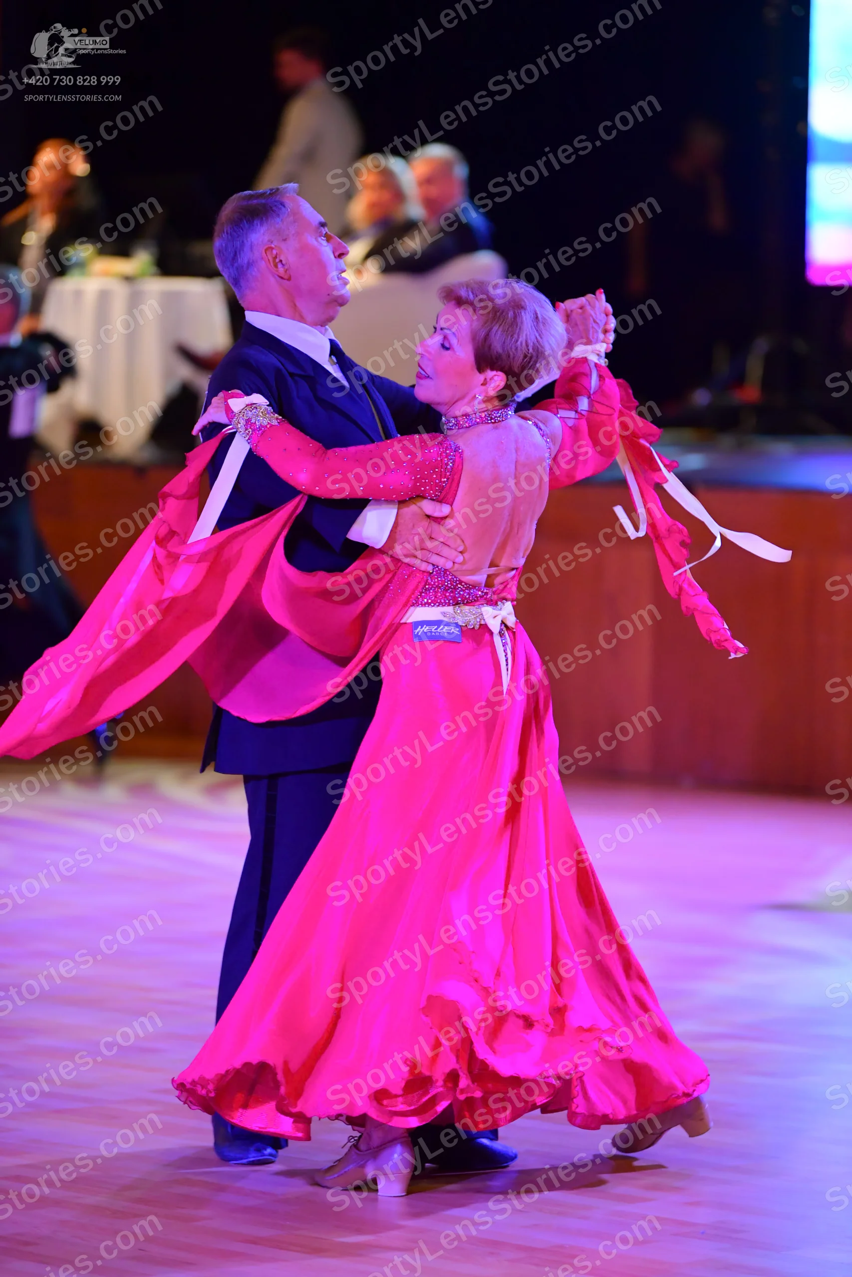 Dancesport competitor: Male:** Black tailsuit with sequin lapels and a black satin shirt