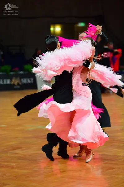 Dancesport competitor: Male dancer: black suit