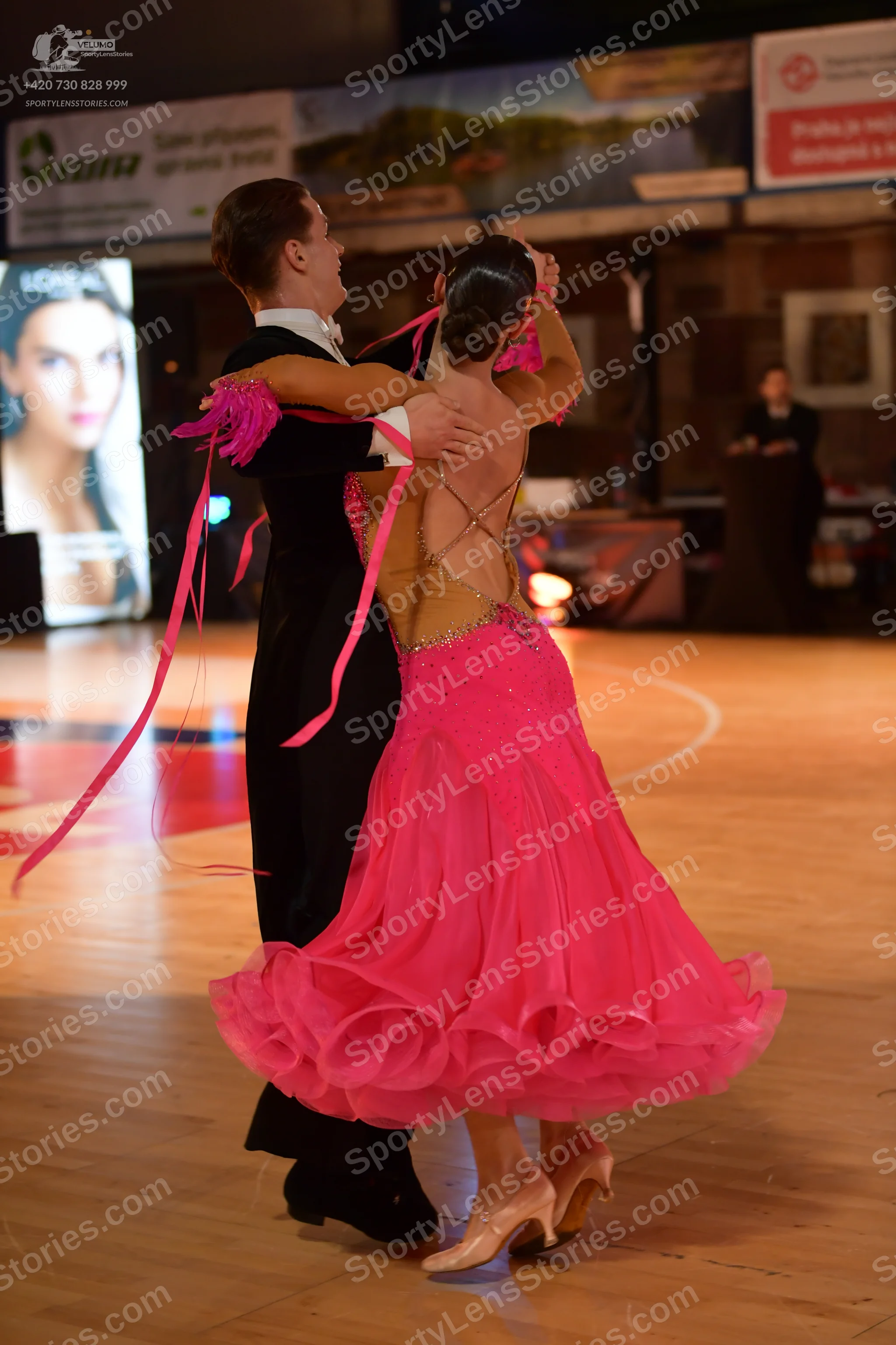 Dancesport competitor: Male dancer: black suit with a white shirt collar