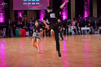 Dancesport competitor #366: Male dancer: black long-sleeved shirt and black trousers