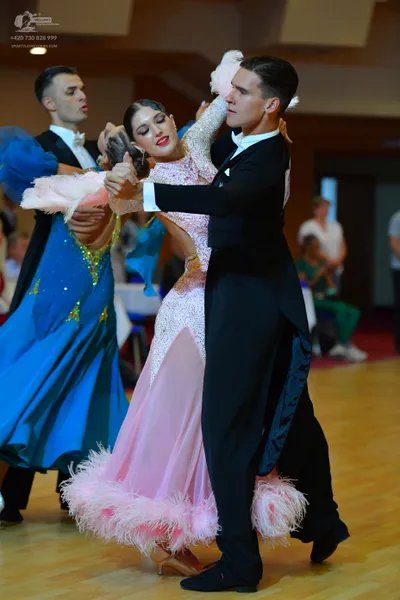 Dancesport competitor: Male dancers: black tailcoats, white shirts, and white bow ties