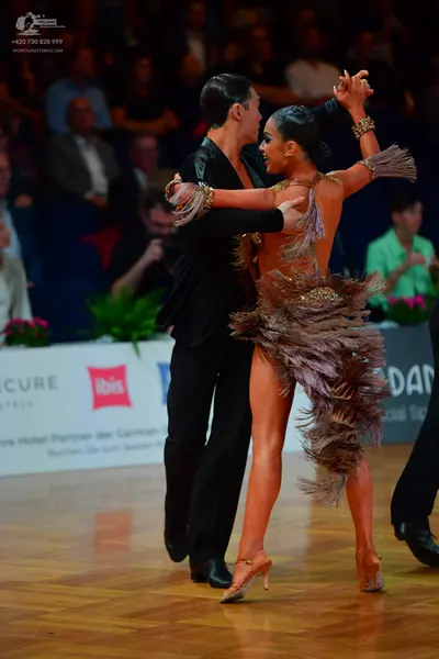 Dancesport competitor: Male dancer: black suit