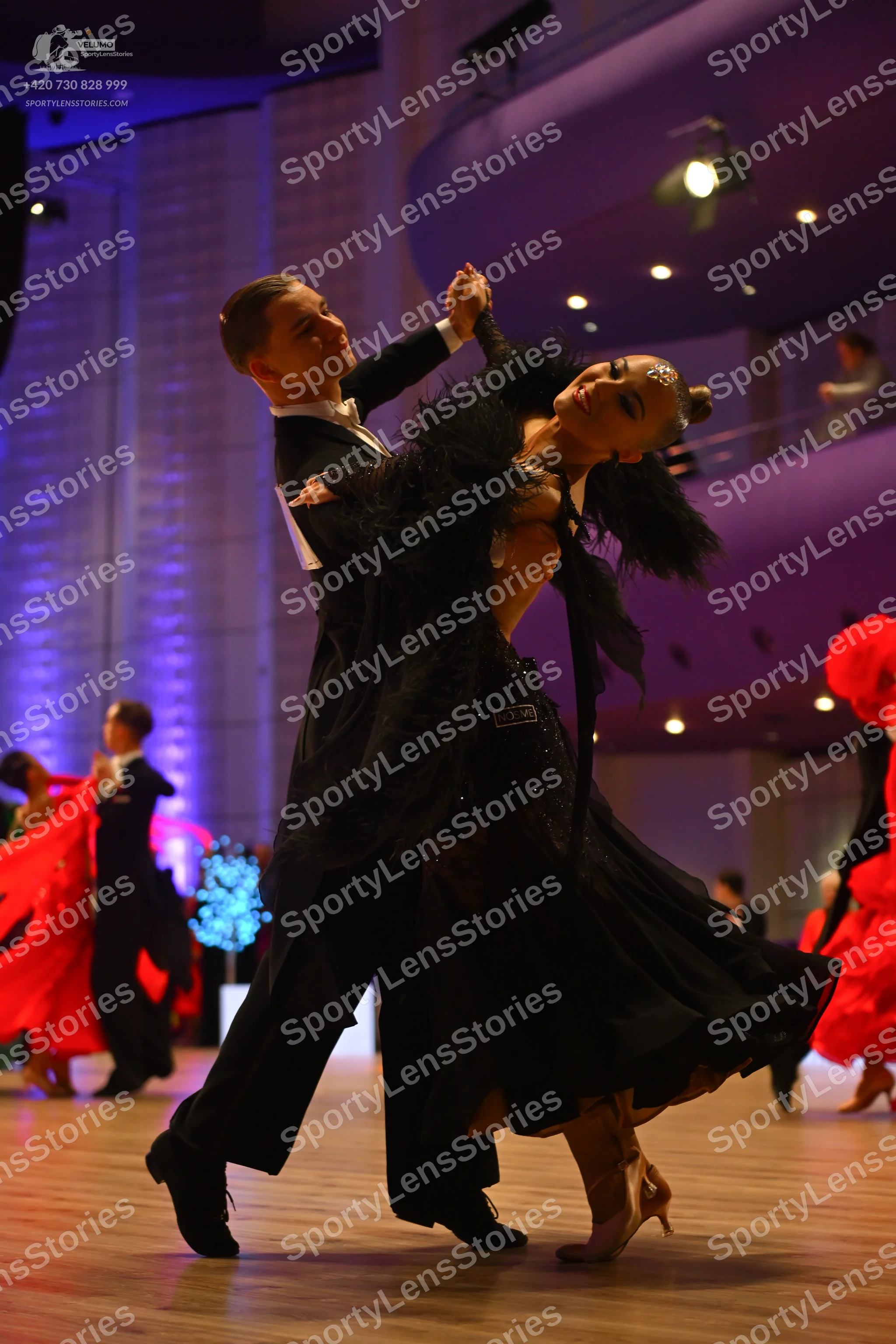 Dancesport competitor: Male dancer: black suit with a white shirt