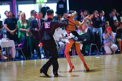 Dancesport competitor #176: Male dancer: black long-sleeved shirt and black trousers