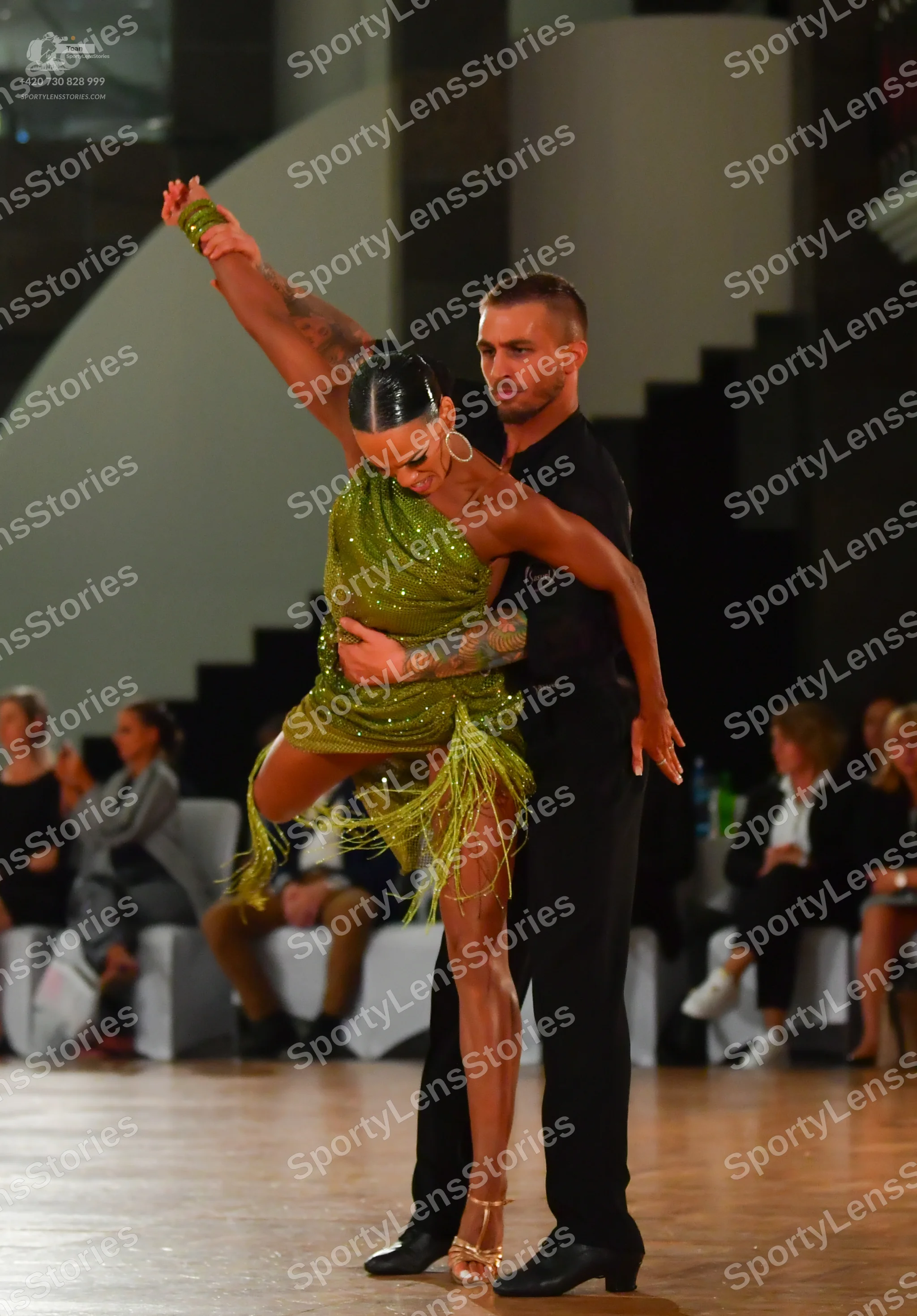 Dancesport competitor: Male dancer: black short-sleeved shirt and black trousers