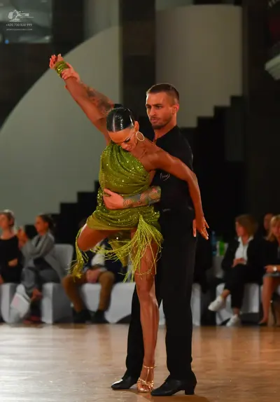 Dancesport competitor: Male dancer: black short-sleeved shirt and black trousers