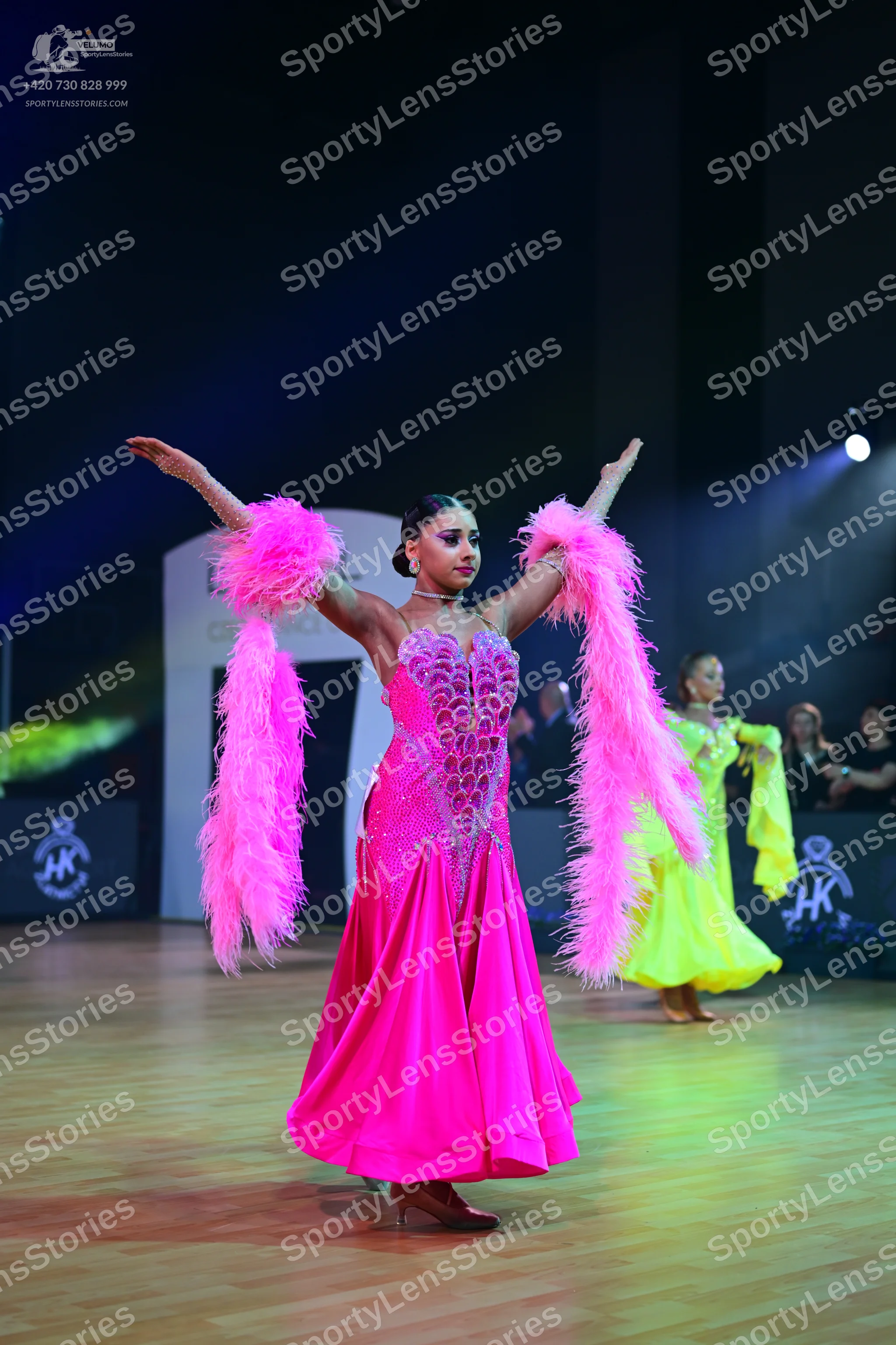 Dancesport competitor: Female dancer 1: pink ballgown with a sparkly, embellished bodice and a satin sk