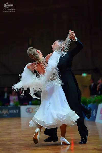 Dancesport competitor: Male dancer: black ballroom suit