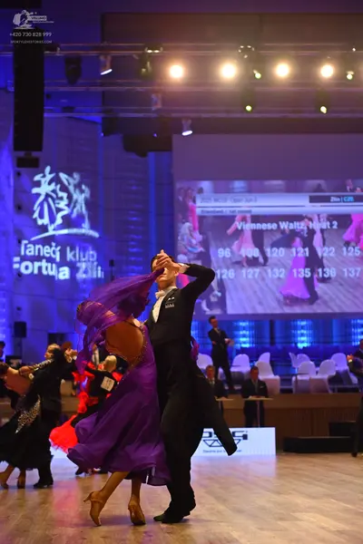 Dancesport competitor: Male dancer: black ballroom suit with a white shirt