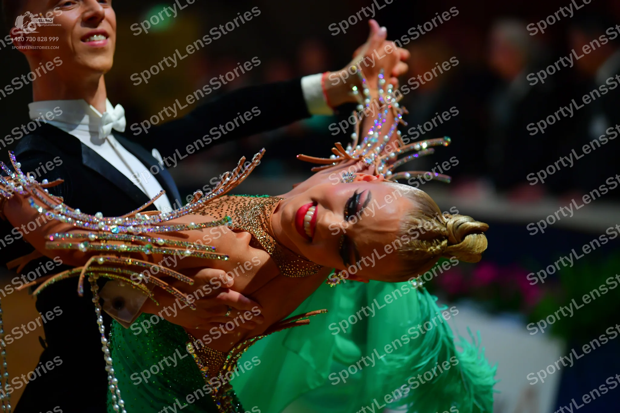 Dancesport competitor: Male dancer: black formal ballroom suit with a white shirt and white bow tie