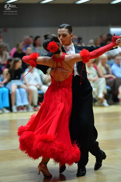 Dancesport competitor: Male dancer: black suit with a white shirt