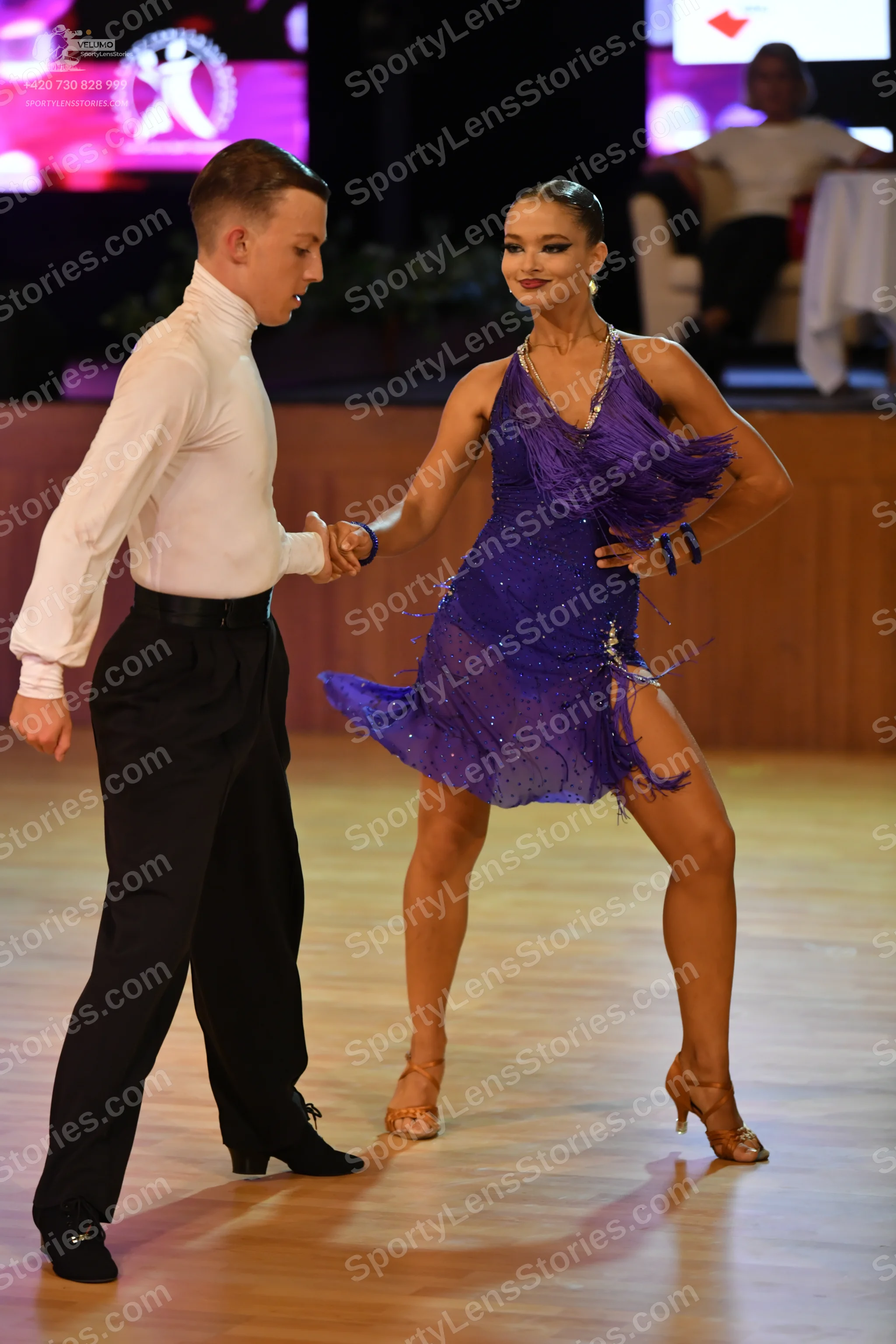 Dancesport competitor: **

*   **Male:** Black suit with sequin lapels, black shoes with silver buckles