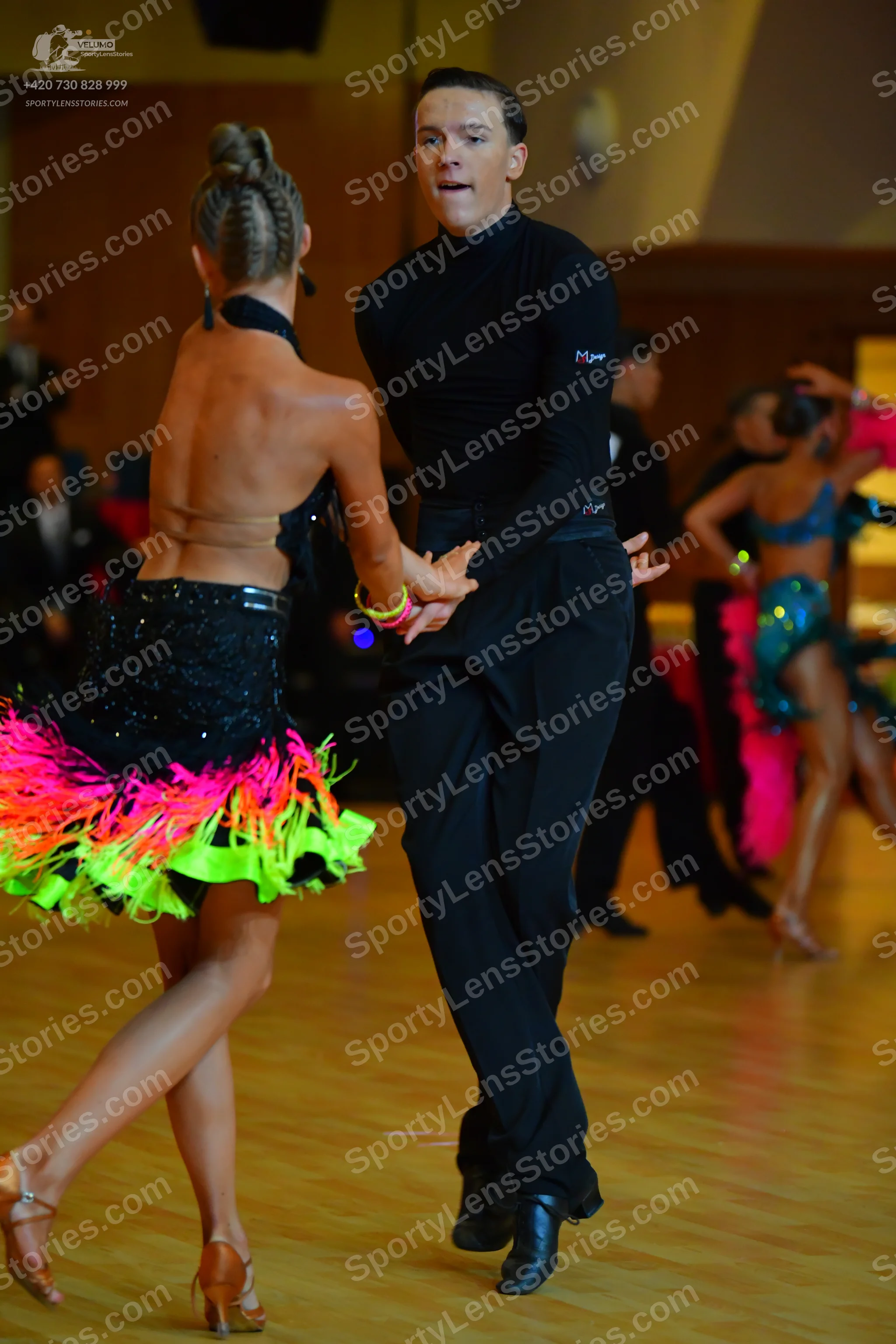 Dancesport competitor: Male dancer: black turtleneck shirt and black trousers