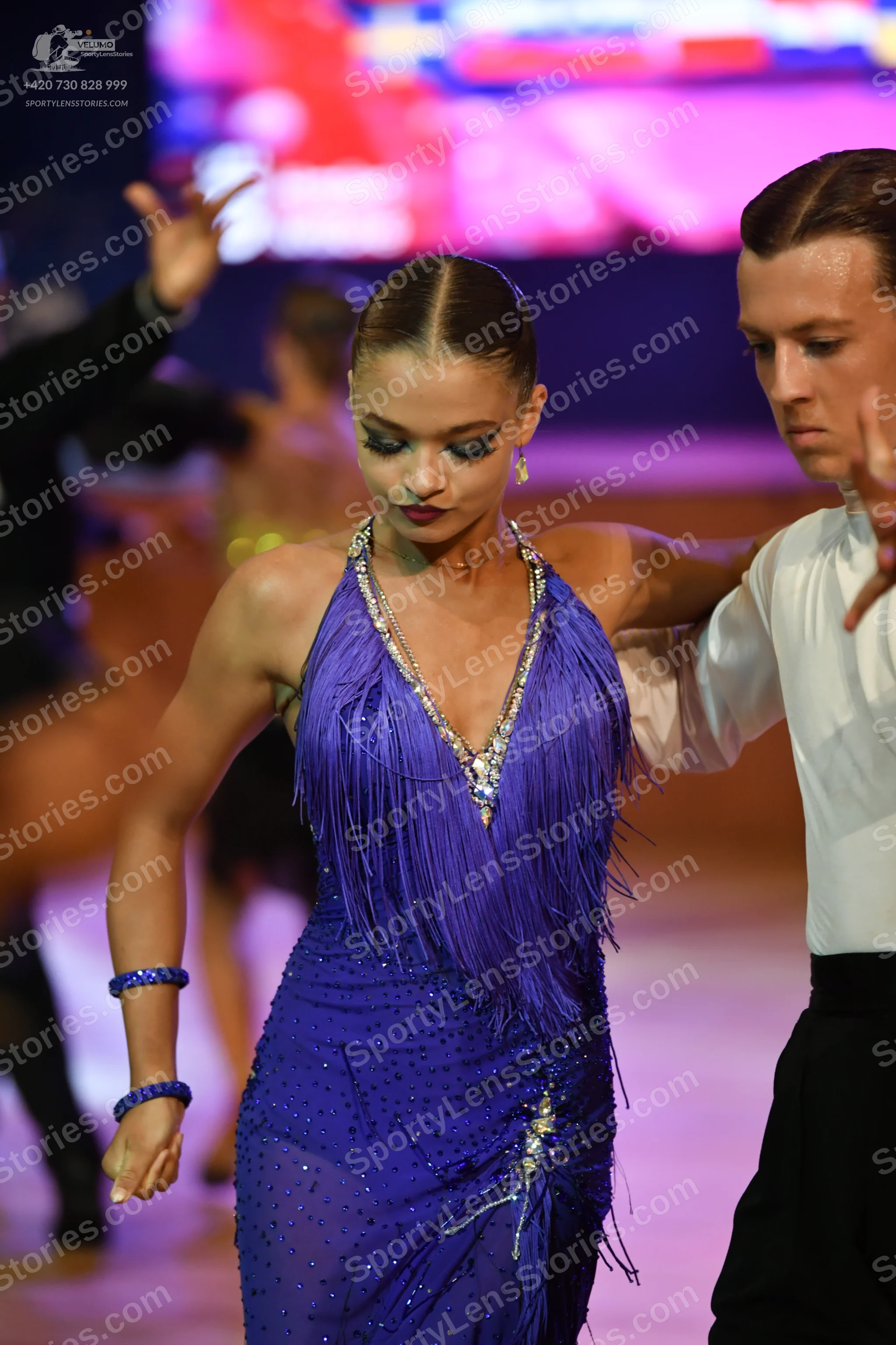 Dancesport competitor: Male**
*   **Color:** Black
*   **Fabric:** Likely satin or a similar smooth fab