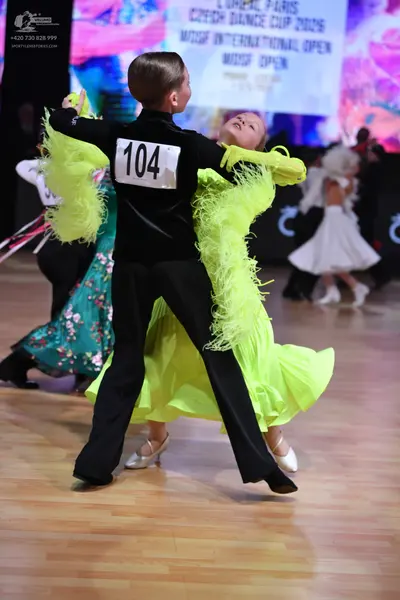 Dancesport competitor: Male dancer: black long-sleeved shirt and black trousers