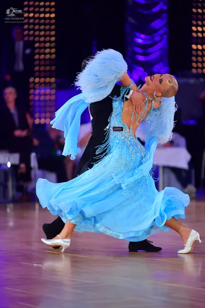 Dancesport competitor: Male dancer: black suit and black dance shoes