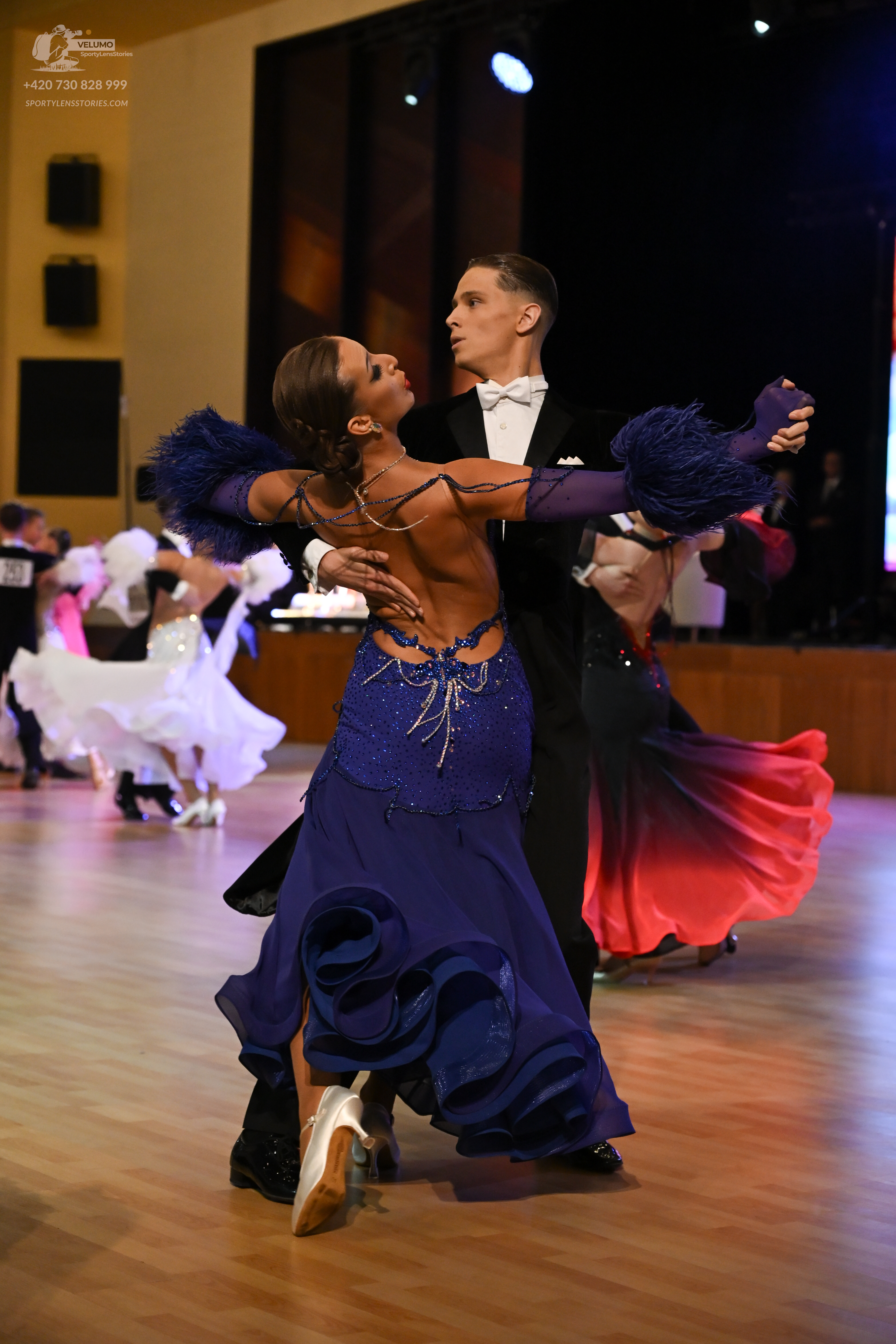 Dancesport competitor: ** Dark Blue Latin Dress
*   **Fabric:** Satin (appears to be a heavily textured