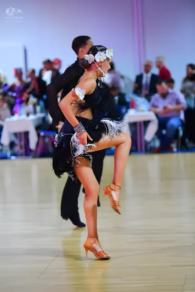 Dancesport competitor: Male dancer: black dance suit
