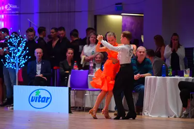 Dancesport competitor: Male dancer: white long-sleeved shirt with black trousers