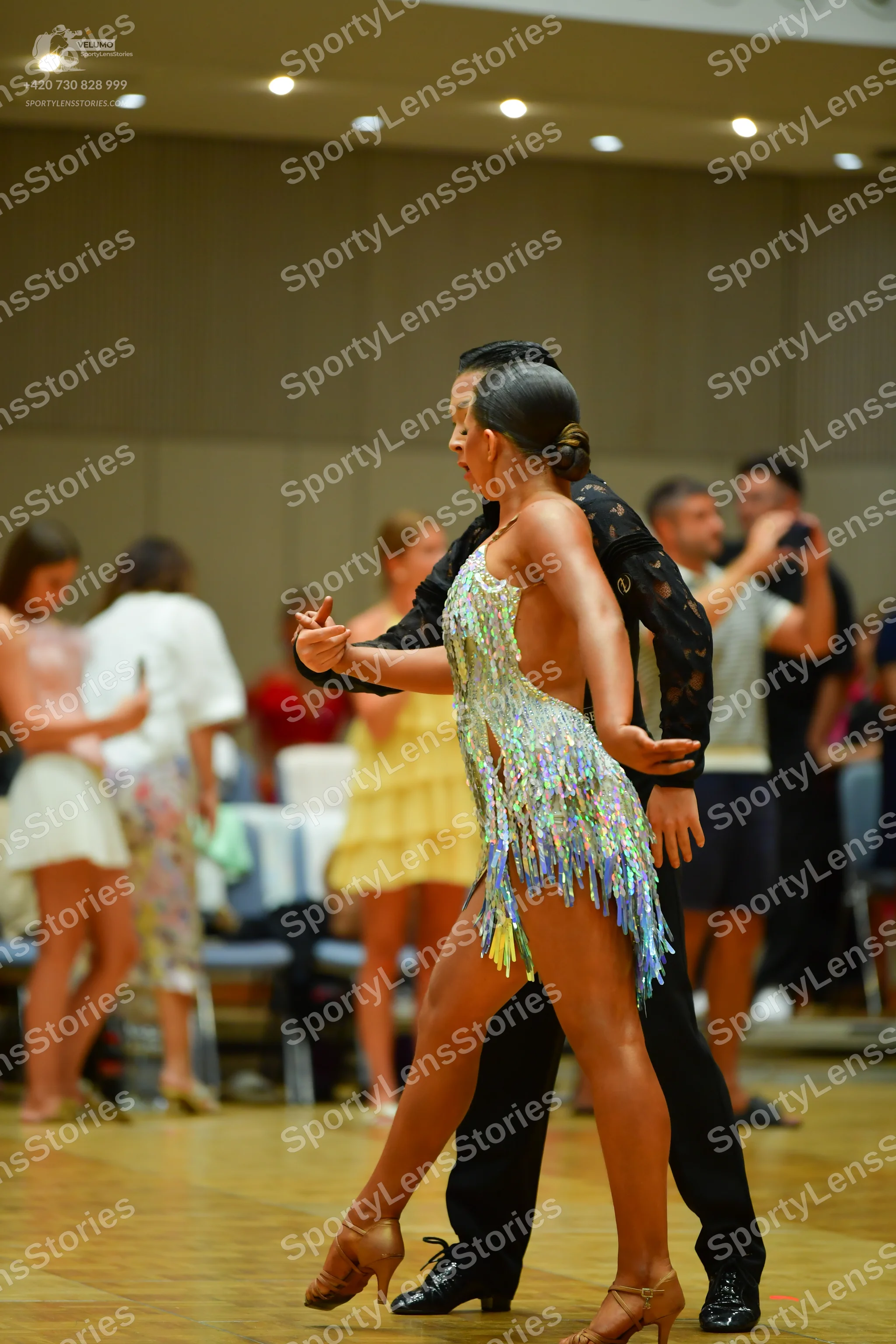 Dancesport competitor: Female dancer: light turquoise/pale blue latin dress with sequins and fringe