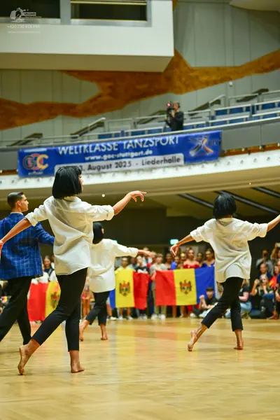 Dancesport competitor: Male dancer: blue checkered shirt and black trousers