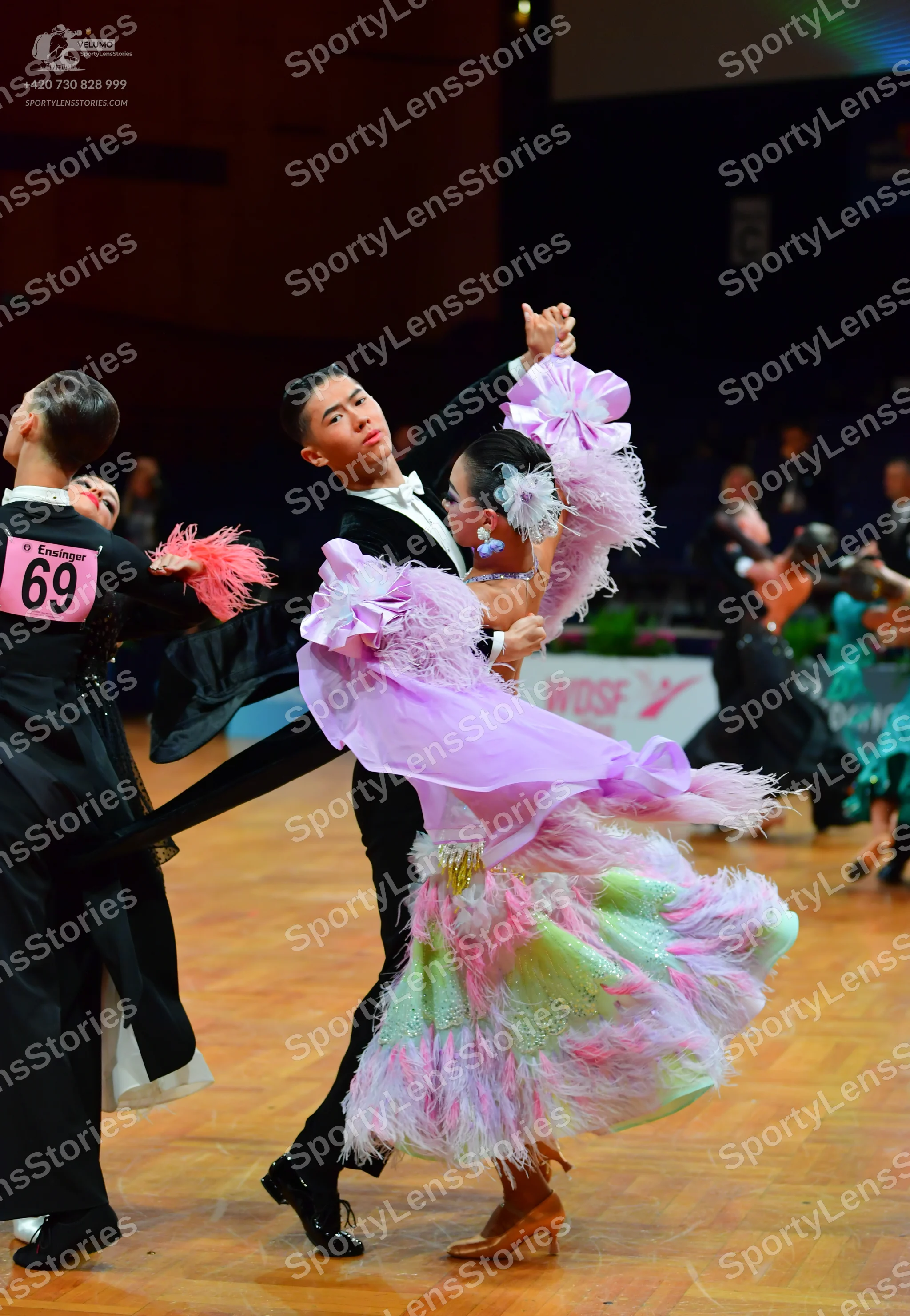 Dancesport competitor: Male dancers: black suits with white shirts and black bowties