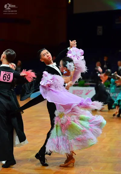 Dancesport competitor: Male dancers: black suits with white shirts and black bowties