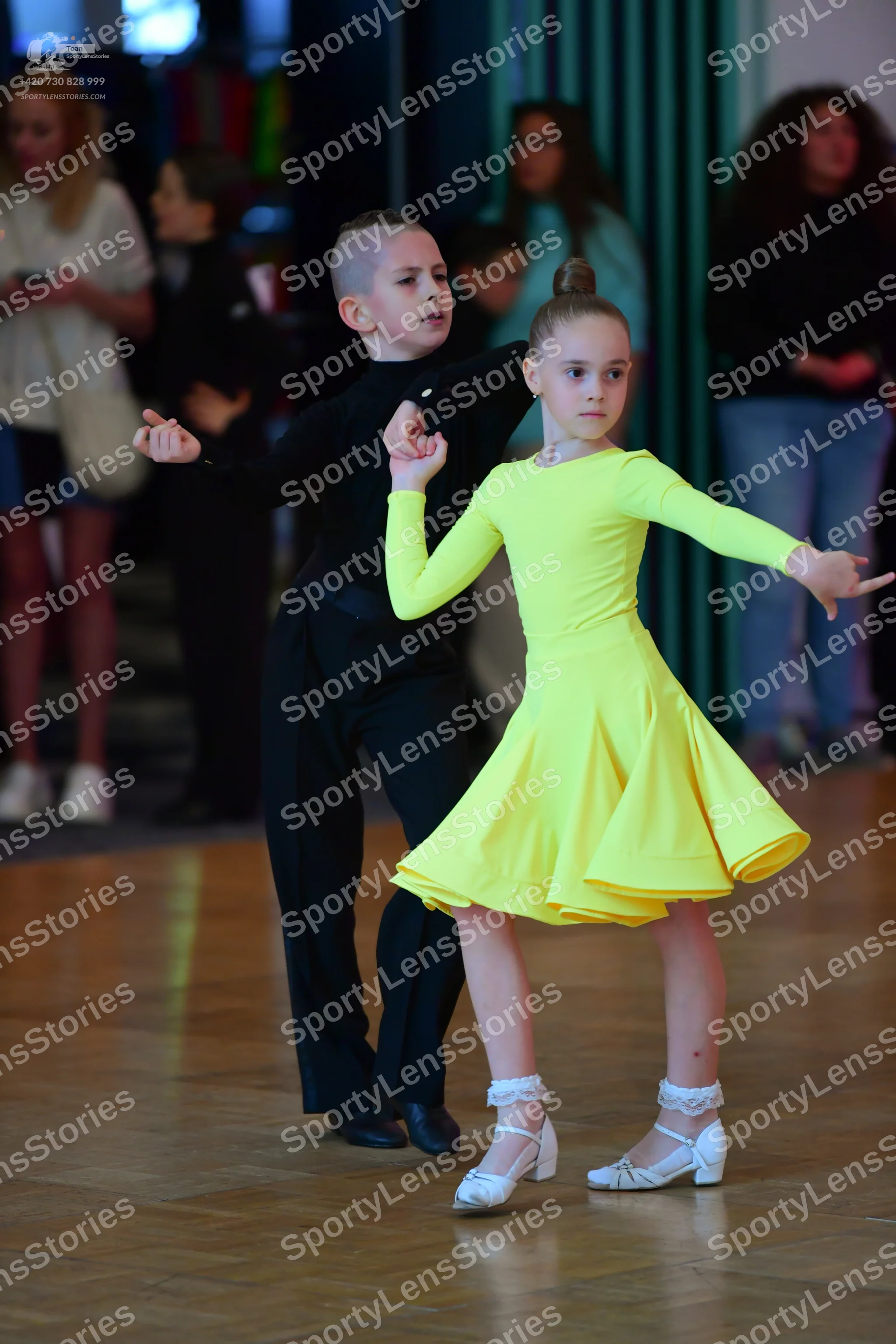 Dancesport competitor: Male dancer: black long-sleeved top and black trousers