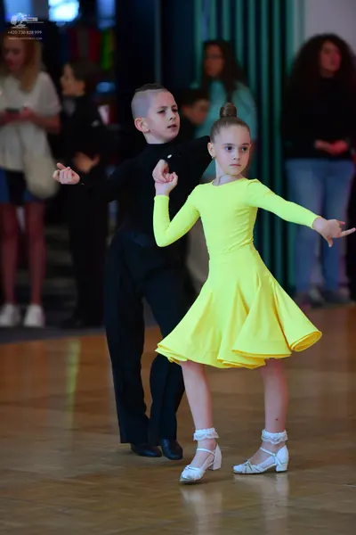 Dancesport competitor: Male dancer: black long-sleeved top and black trousers