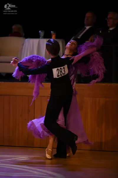 Dancesport competitor #283: ** Black tail suit
*   **Fabric:** Satin
*   **Style:** Tail suit
*   **Accessor