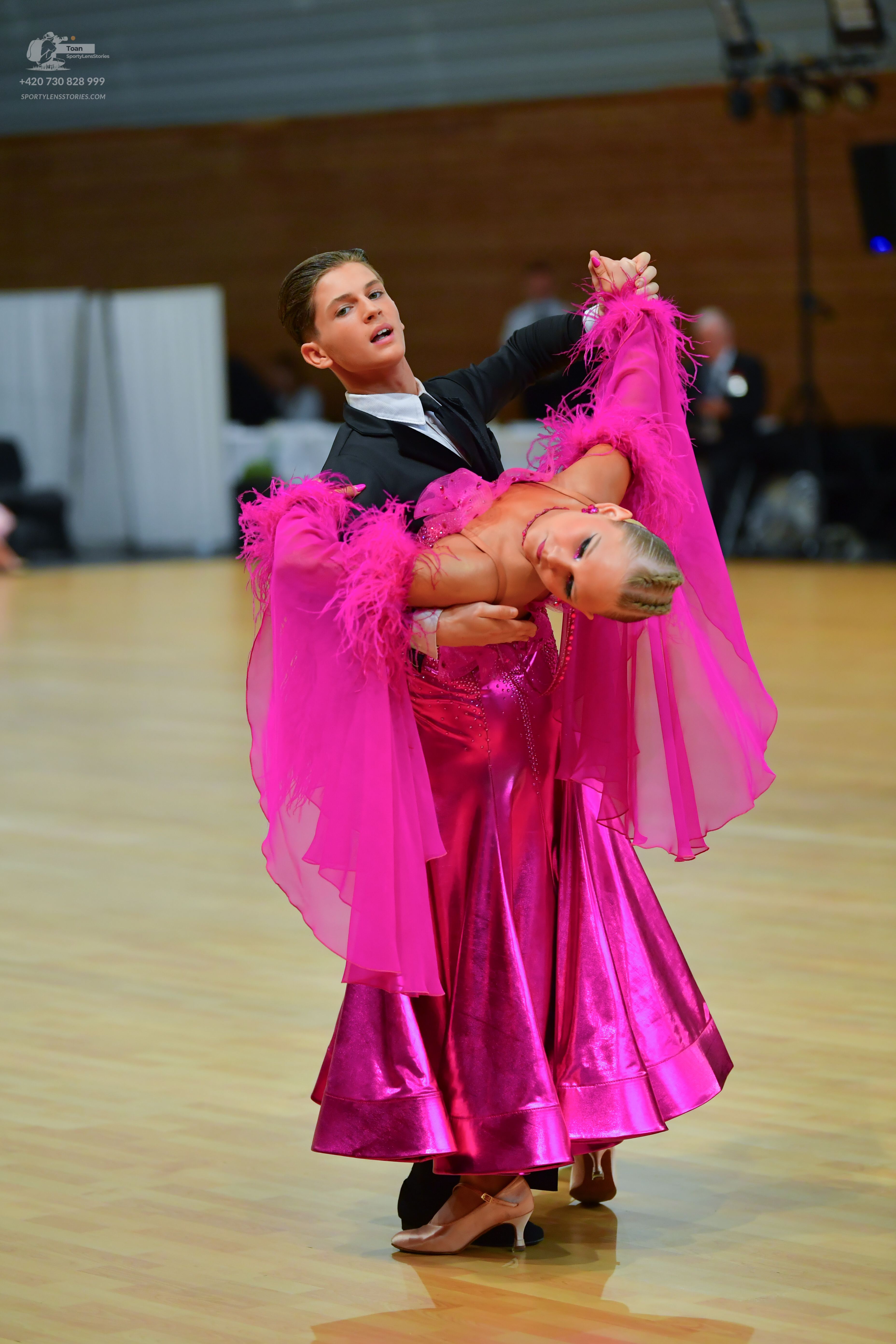 Dancesport competitor: Male:** Black tail suit with silver sequin lapels and detailing