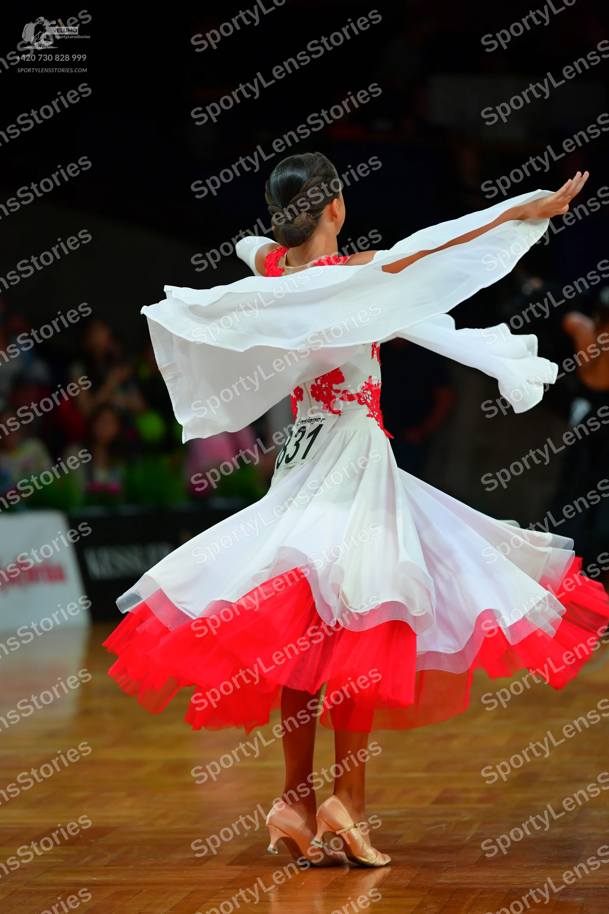 Dancesport competitor: Female dancer: white and red Latin dance dress with red lace detailing on the bo