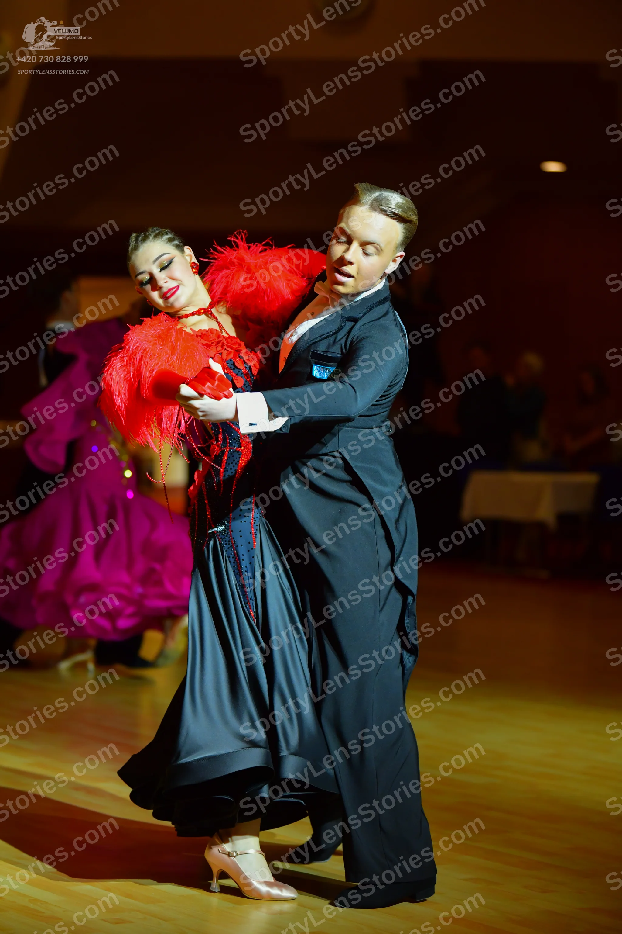 Dancesport competitor: Male dancer: black ballroom suit with a white shirt