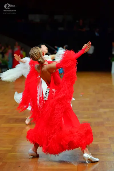 Dancesport competitor #815: Female dancer: red latin dress with voluminous red feathers