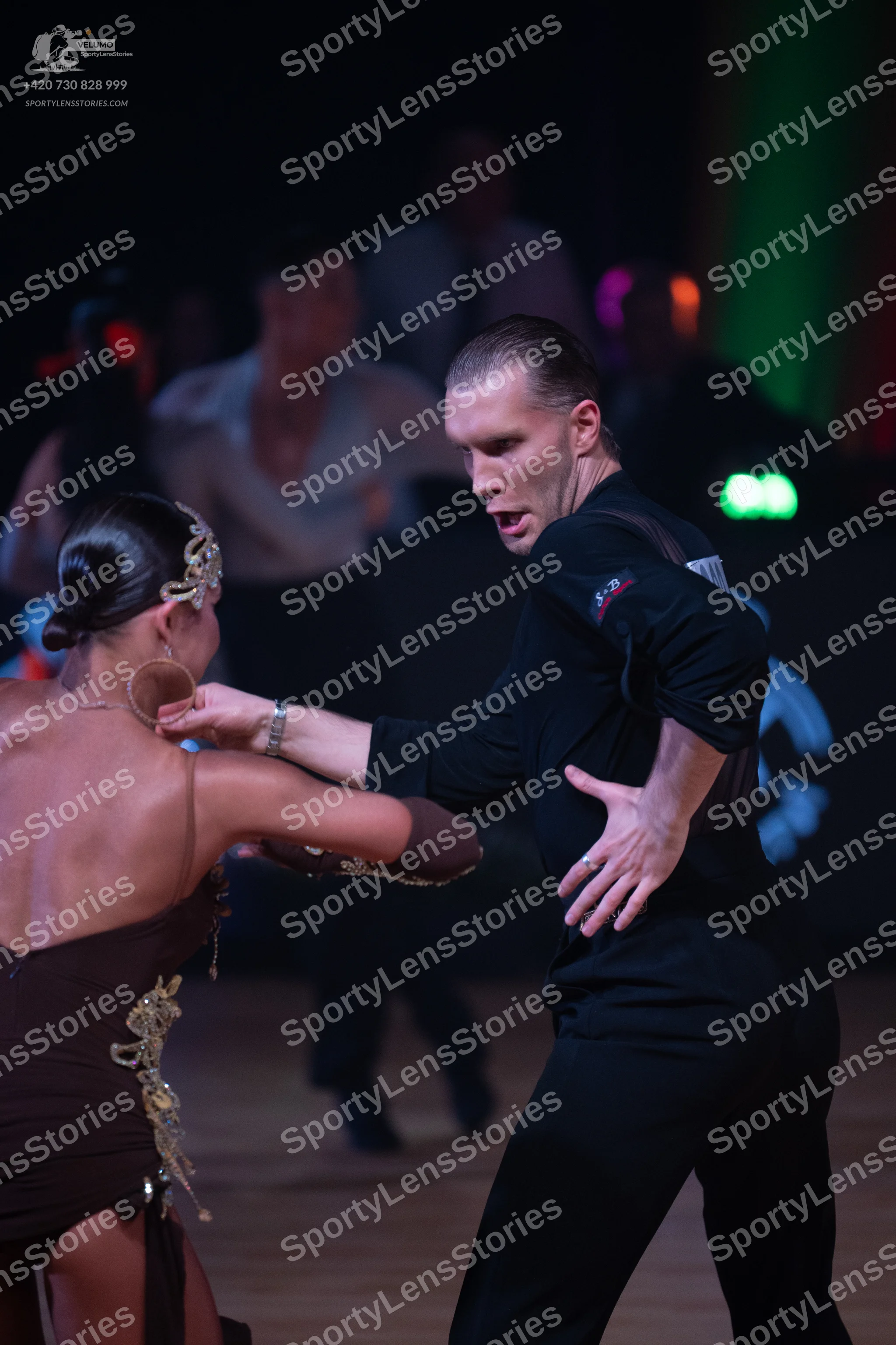 Dancesport competitor: Male dancer: black long-sleeve shirt and black trousers