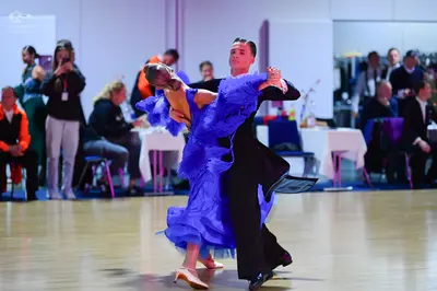 Dancesport competitor: Male dancer: black ballroom suit