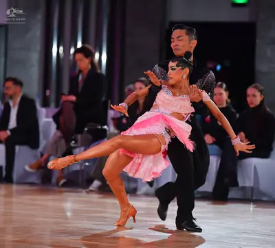 Dancesport competitor: Male dancer: black long-sleeved dance shirt and black trousers