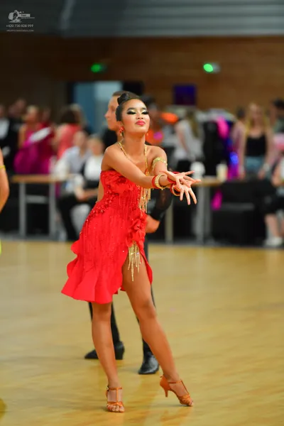 Dancesport competitor: Male:** Black tailsuit with sequin lapels