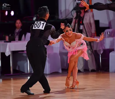 Dancesport competitor #601: Male dancer: black suit with sequin details on the upper back