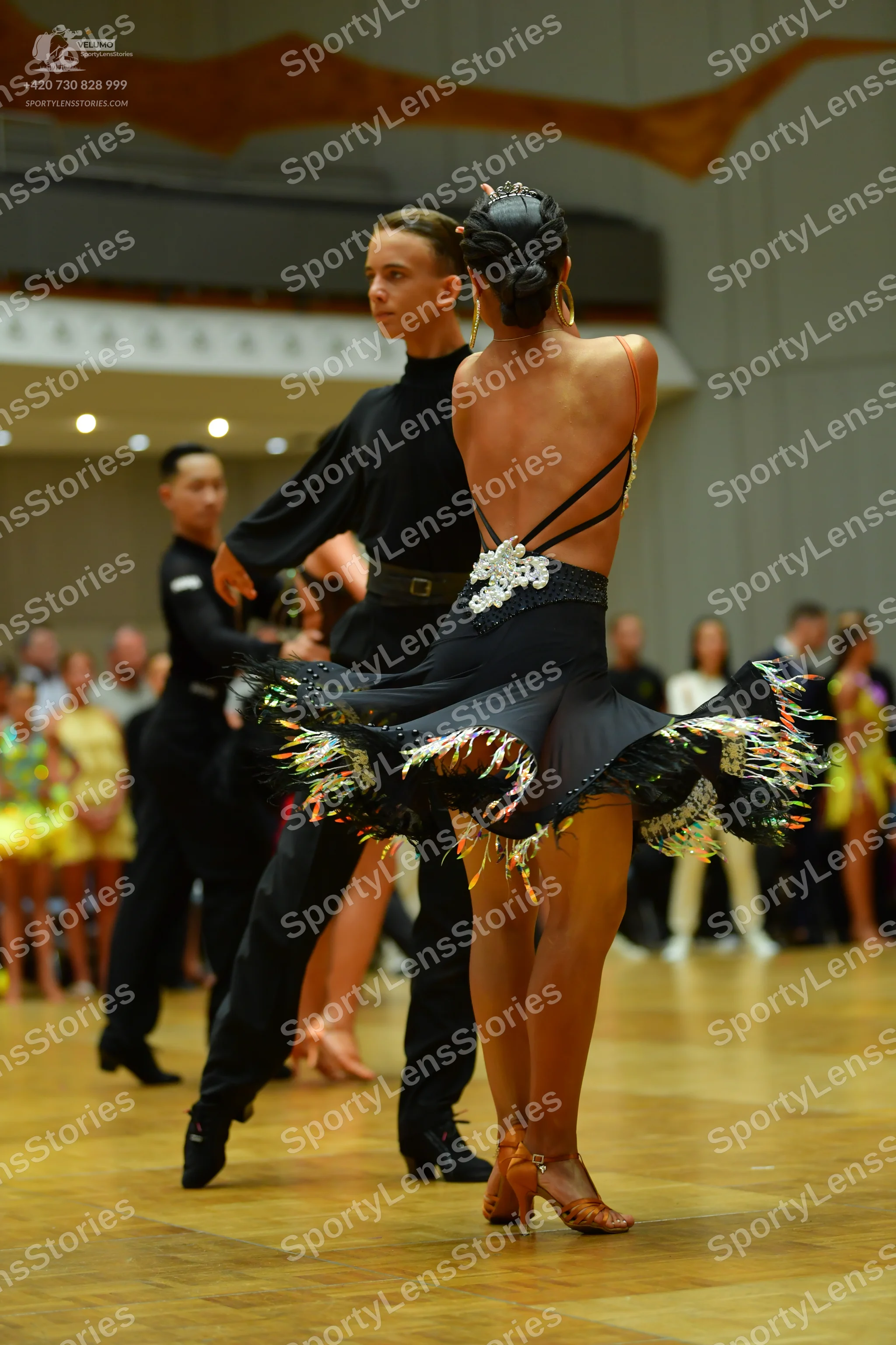 Dancesport competitor: Male dancer: black long-sleeved shirt and black trousers with a black belt