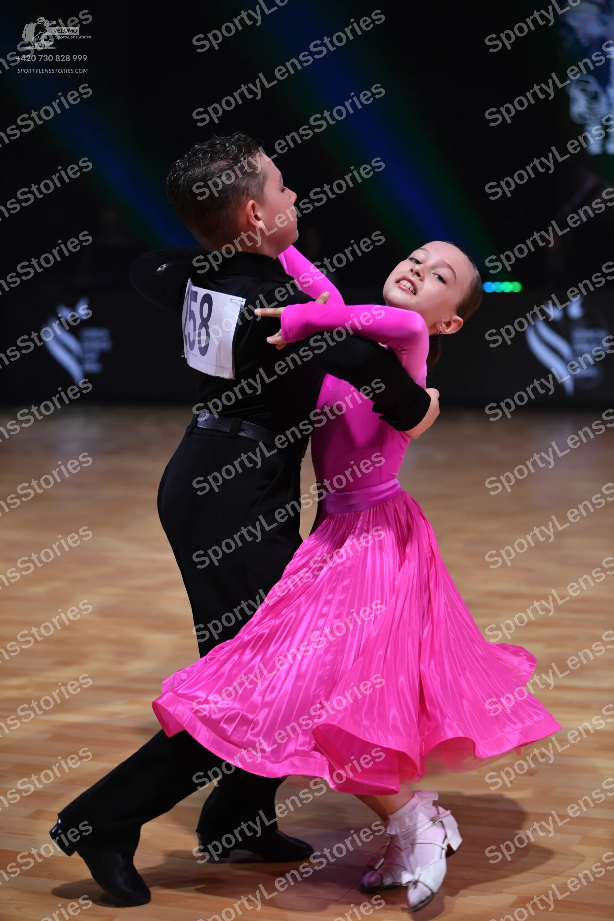 Dancesport competitor: Male dancer: black long-sleeved shirt and black trousers