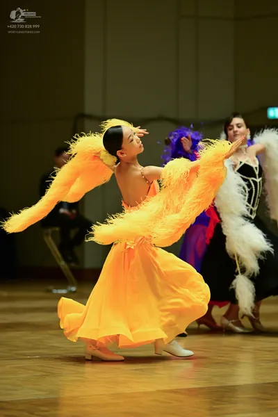 Dancesport competitor: **  Bright Yellow, flowing gown