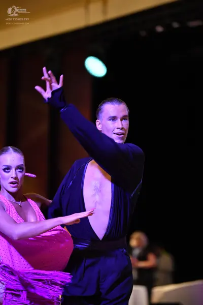 Dancesport competitor: ** Black tail suit