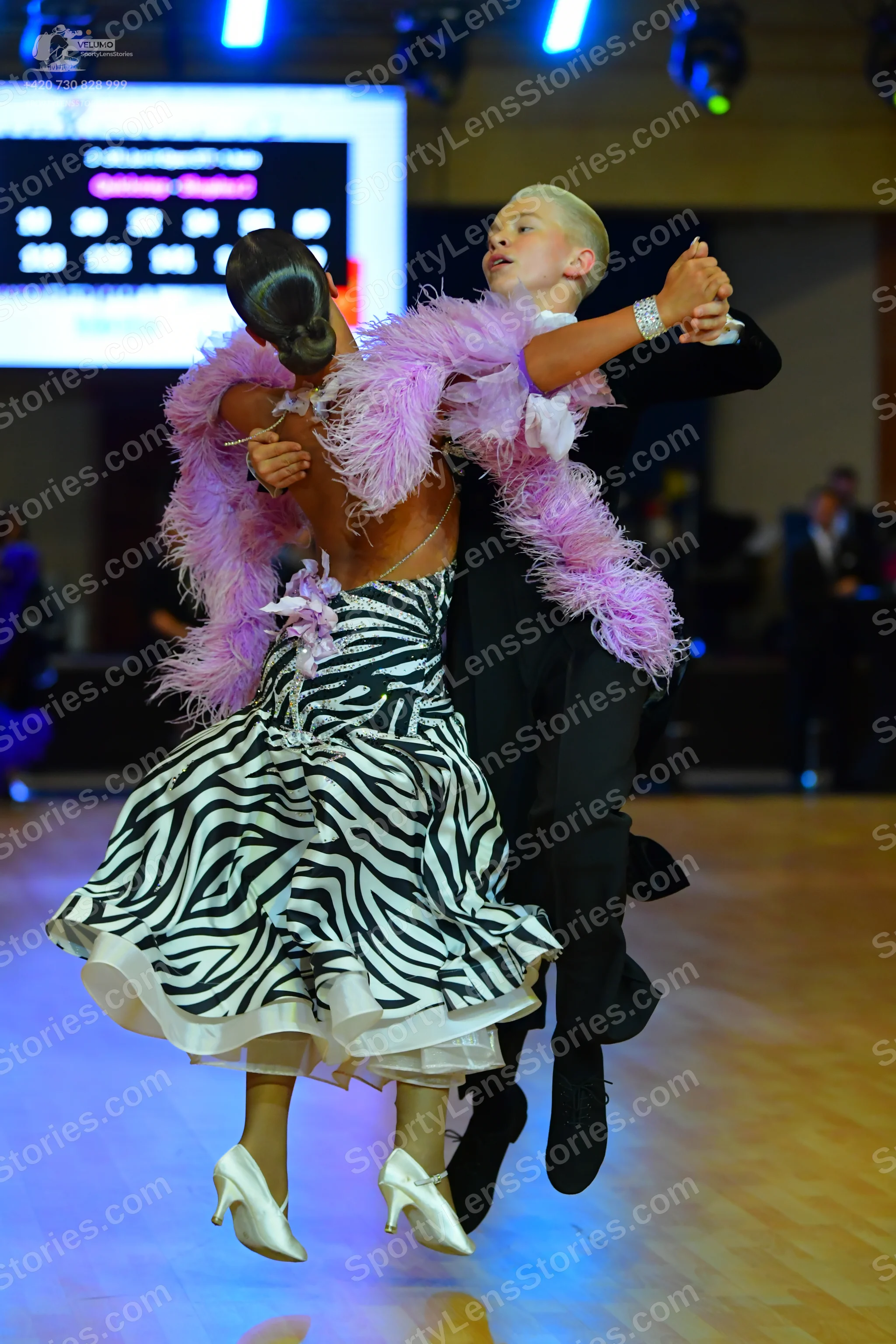 Dancesport competitor: Male dancer: black suit with a white shirt and black dance shoes